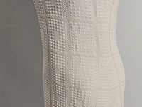 [255]N WANGARAY · Seamless knit dress with geometric hollow-out stitching, rich details and a slim fit